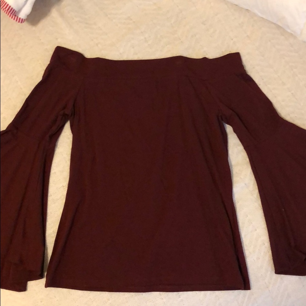 Express off the shoulder top with wide arms.